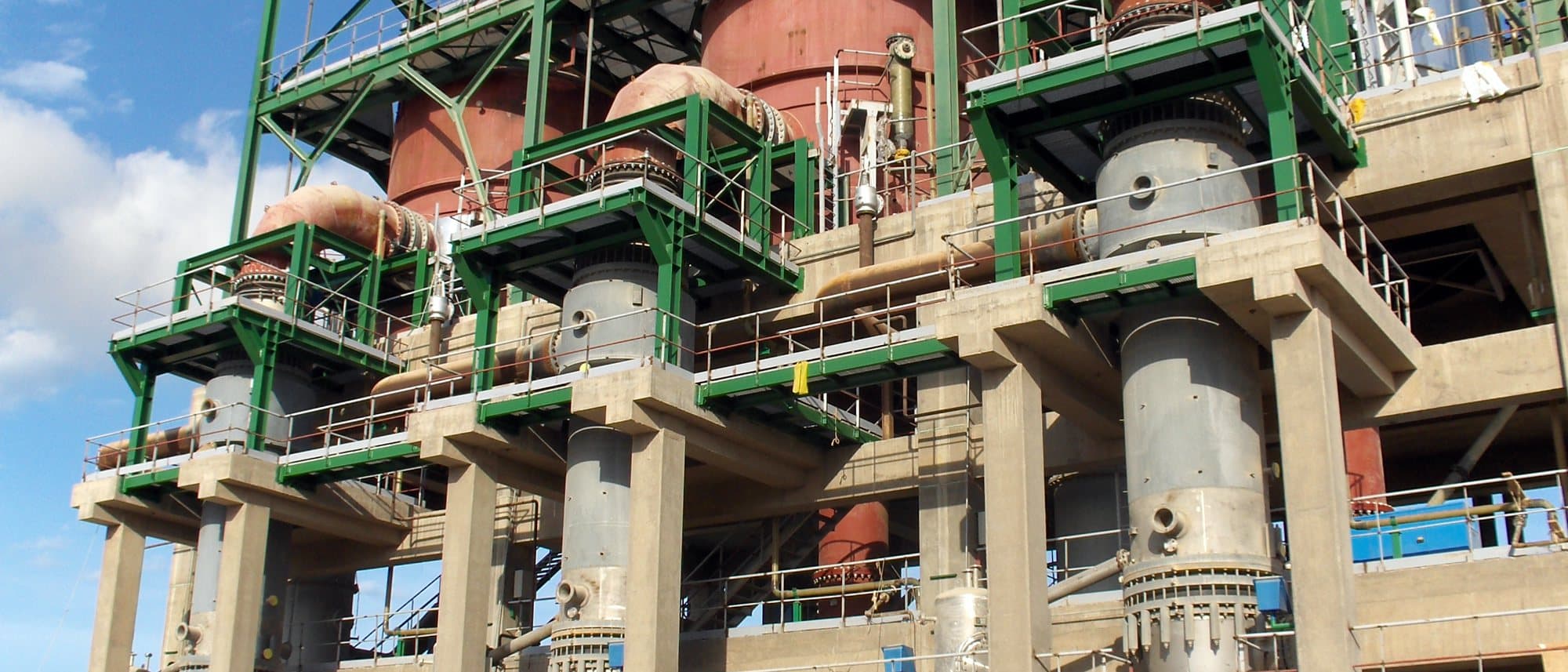 The completed process unit, its steel vessels installed in a concrete and structural steel frame